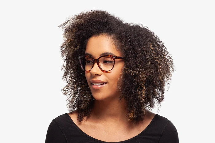 Emerald Tortoise Amy eyeglasses by Chemistrie worn by female model, side view