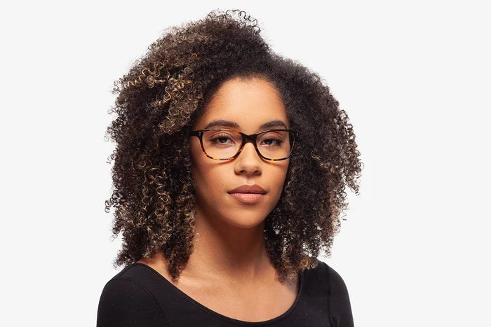 Emerald Tortoise eyeglasses by Chemistrie worn by female model, front view