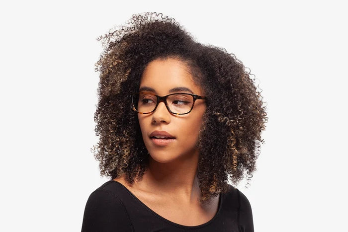 Emerald Tortoise eyeglasses by Chemistrie worn by female model, side view
