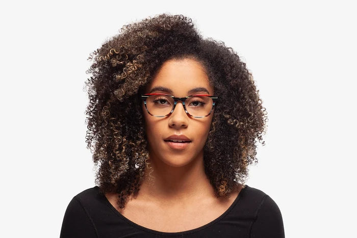 Grey Stripe Chriss eyeglasses by Chemistrie worn by female model, front view