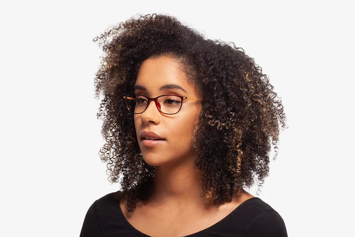 Burgundy Deborah eyeglasses by Chemistrie worn by female model, side view