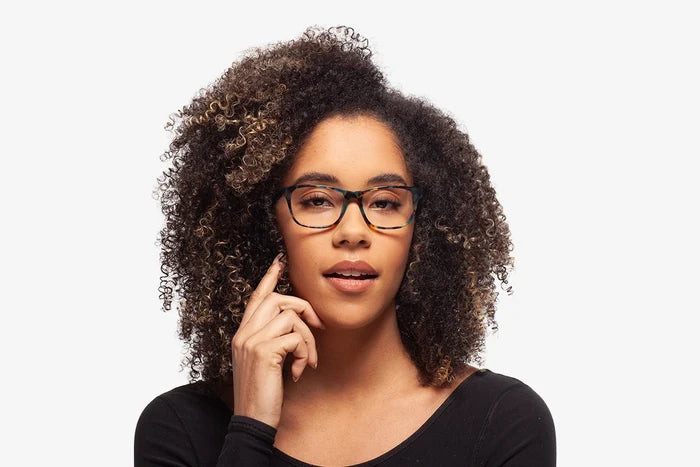 Blue Tortoise Harper eyeglasses by Chemistrie worn by female model, front view