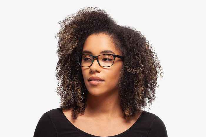Blue Tortoise Harper eyeglasses by Chemistrie worn by female model, side view