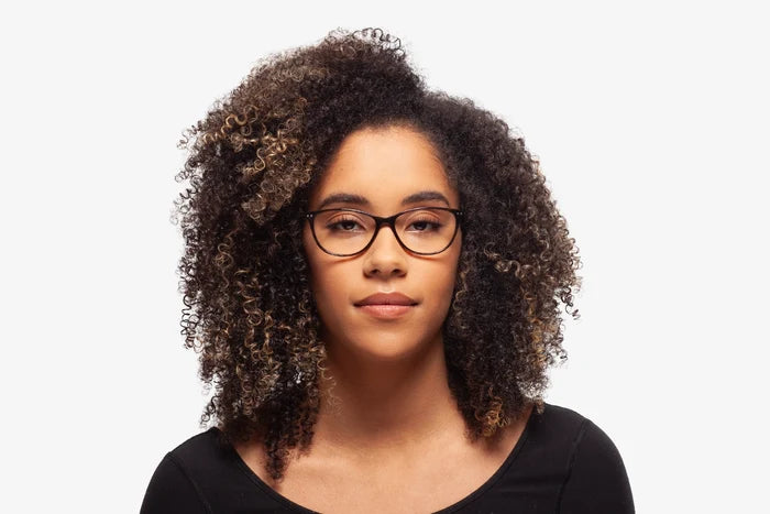Green Julia eyeglasses by Chemistrie worn by female model, front view