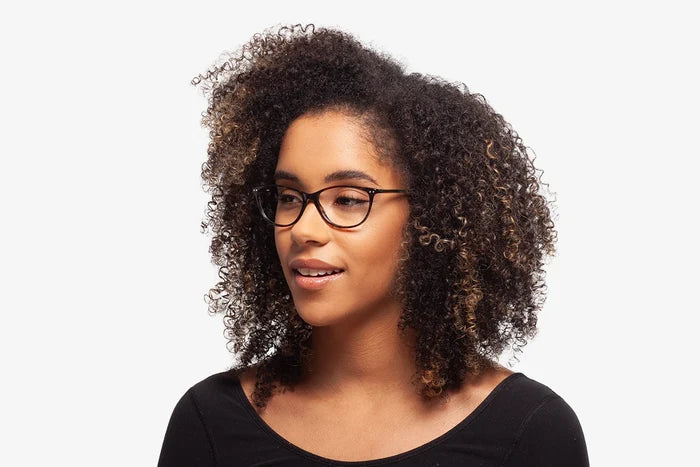 Green Julia eyeglasses by Chemistrie worn by female model, side view