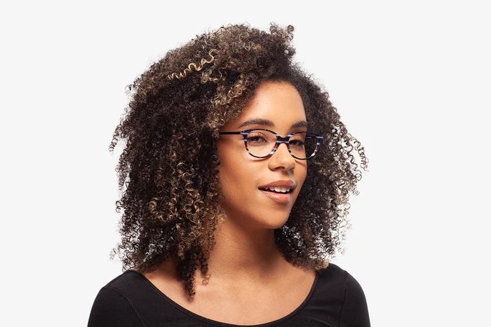 Blue Laura eyeglasses by Chemistrie worn by female model, side view