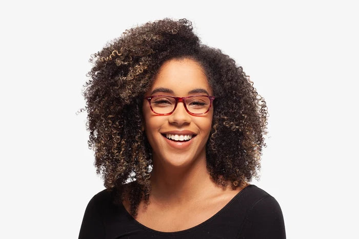 Raspberry Milan eyeglasses by Chemistrie worn by female model, front view