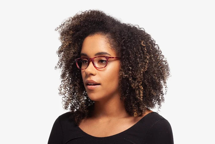 Raspberry Milan eyeglasses by Chemistrie worn by female model, side view