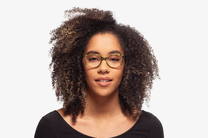 Green Tortoise Modena eyeglasses by Chemistrie worn by female model, front view