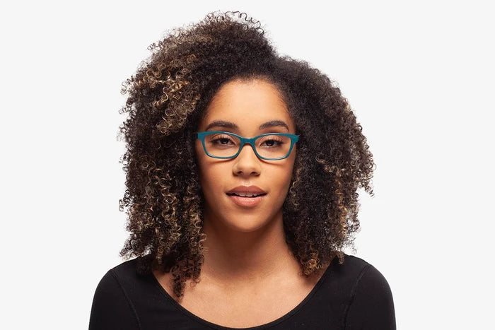 Teal Nicky eyeglasses by Chemistrie worn by female model, front view