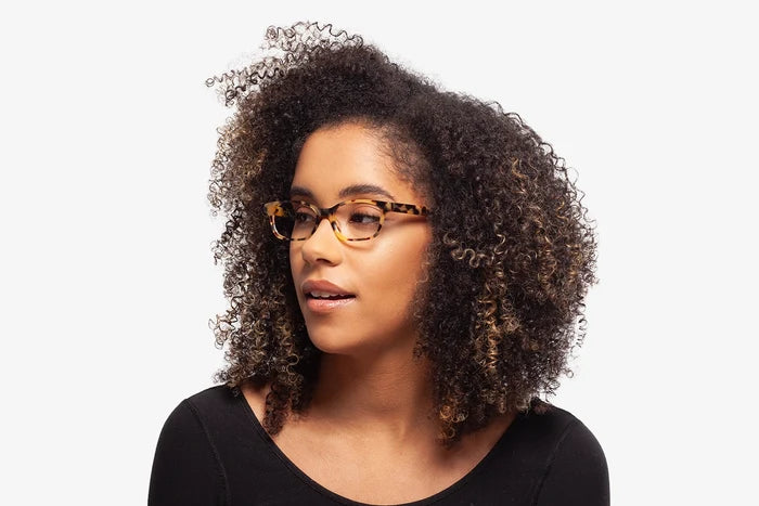 Teal Nicky eyeglasses by Chemistrie worn by female model, front view
