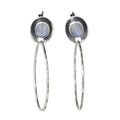 Pair of silver earrings with rainbow moonstones on a white background