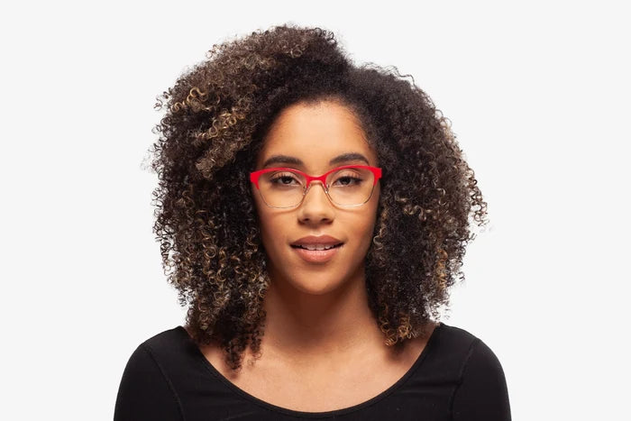 Pink Rebecca eyeglasses by Chemistrie worn by female model, front view