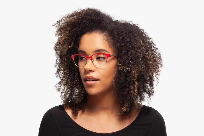 Pink Rebecca eyeglasses by Chemistrie worn by female model, side view