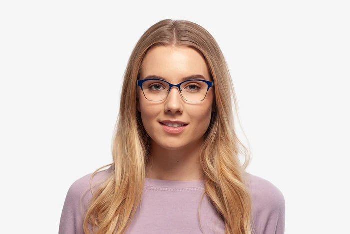 Blue Rebecca eyeglasses by Chemistrie worn by female model, front view