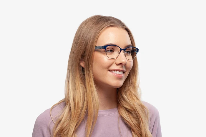 Blue Rebecca eyeglasses by Chemistrie worn by female model, side view
