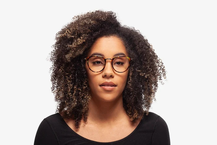 Tortoise Stacey eyeglasses by Chemistrie worn by female model, front view