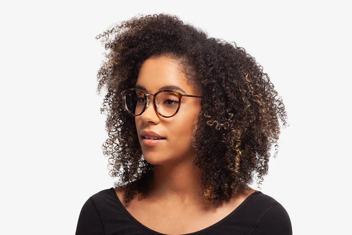 Tortoise Stacey eyeglasses by Chemistrie worn by female model, side view