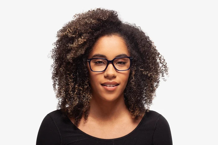 Blue Tanner eyeglasses by Chemistrie worn by female model, front view