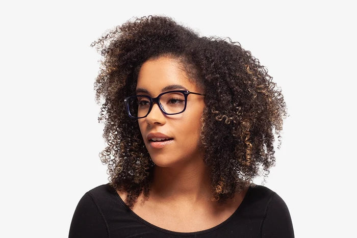 Blue Tanner eyeglasses by Chemistrie worn by female model, side view
