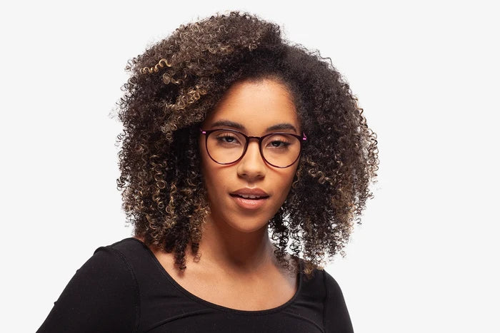 Purple Taylor eyeglasses by Chemistrie worn by female model, front view