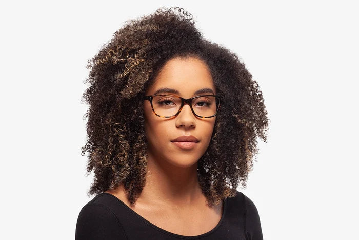 Tortoise Trento eyeglasses by Chemistrie worn by female model, front view